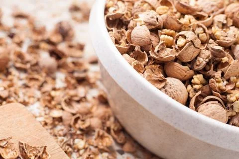 Shelling walnuts in the kitchen Stock Photos
