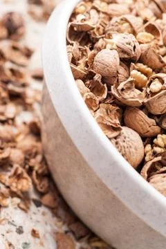 Shelling walnuts in the kitchen Stock Photos