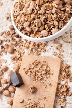 Shelling walnuts in the kitchen Stock Photos