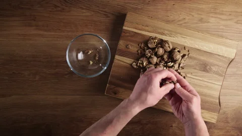 Shelling Walnuts with a Nutcracker Video stock 233550305
