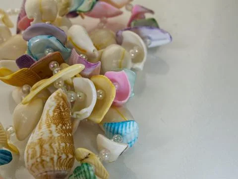 Shells and beads on white background 스톡 사진