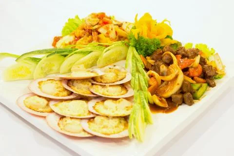 Shells, clams, squid and beef Stock Photos