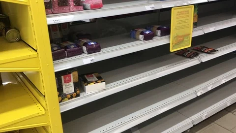 Shelves and racks in a store during a panic and quarantine for coronavirus in Video stock 126922927