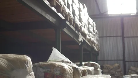 Shelves of cardboard boxes inside a storage food warehouse Stock Footage 88362954