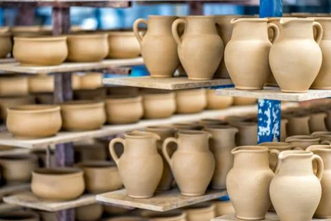 Shelves with ceramic dishware Stock Photos