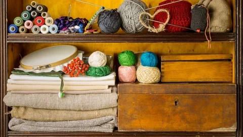 Shelves filled by materials and tools for handmade. Burning incense stick Stock Footage 85386773