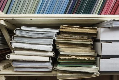 Shelves with folders with documentation Stock Photos