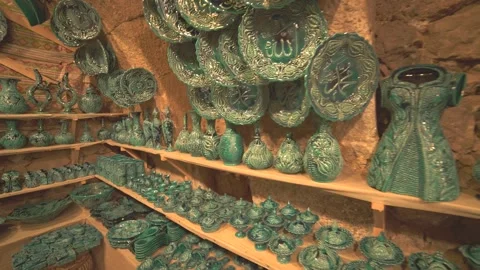 Shelves packed with handmade ceramics - Decorative Tableware and Retail Display Stock Footage 339745503