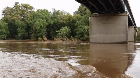 Shenandoah river flowing waves under bridge Stock Footage 97582269