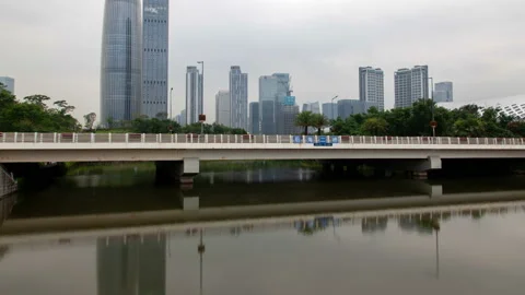 Shenzhen China timelapse at night with reflection in water Stock Footage 121232555