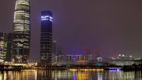 Shenzhen China timelapse at night with reflection in water Stock Footage 121232831