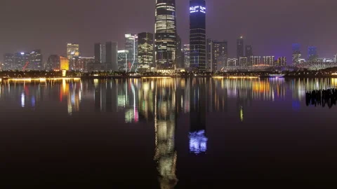 Shenzhen China timelapse at night with reflection in water Stock Footage 121232908