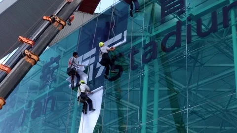 Shenzhen, China: workers working at high altitude Stock Footage 90158848
