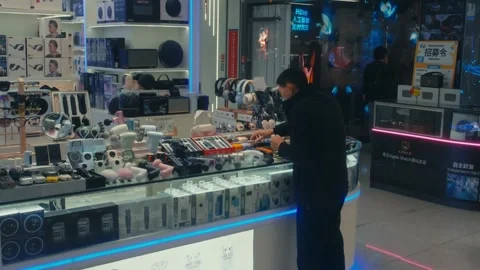 Shenzhen Electronics Shop Interior with Gadgets Headphones and Tech Accessories Stock Footage 333923998