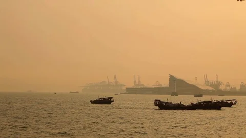 Shenzhen west port, traditional fishing boats in foreground Stock Footage