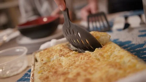 Sheperds pie or corn casserole being scooped from oven hot dish 2 Stock Footage 123738635
