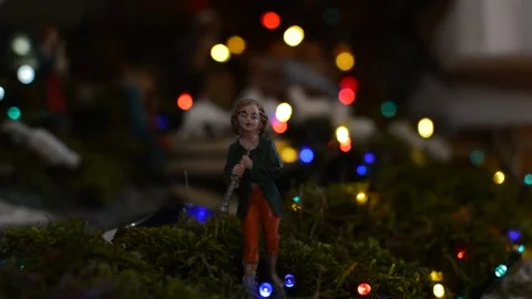 A shepherd of the crib in front of the nativity. 스톡 동영상 167204400