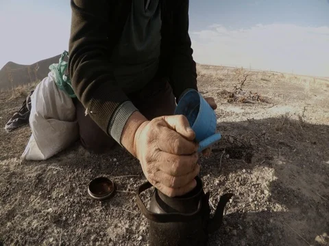 Shepherds cook tea on fire from dry grass on a background Dry mountainous area Stock Footage 77879605