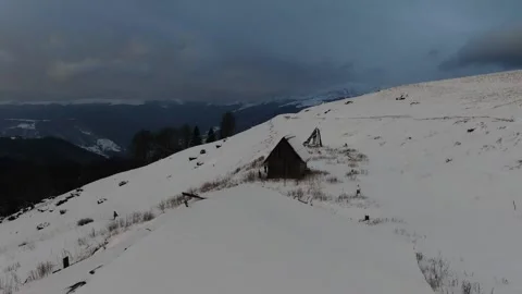 Shepherds' huts on snow-covered meadows. Carpathians. Ukraine. Petros, Sheshu Stock Footage 169224050