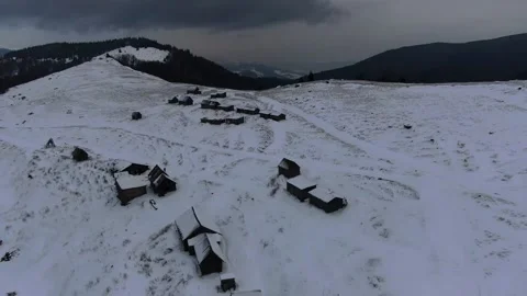 Shepherds' huts on snow-covered meadows. Carpathians. Ukraine. Petros, Sheshu Stock Footage 169224052