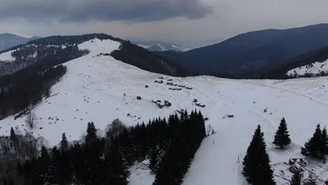 Shepherds' huts on snow-covered meadows. Carpathians. Ukraine. Petros, Sheshu Stock Footage 169396826
