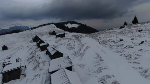 Shepherds' huts on snow-covered meadows. Carpathians. Ukraine. Petros, Sheshu Stock Footage 169396856