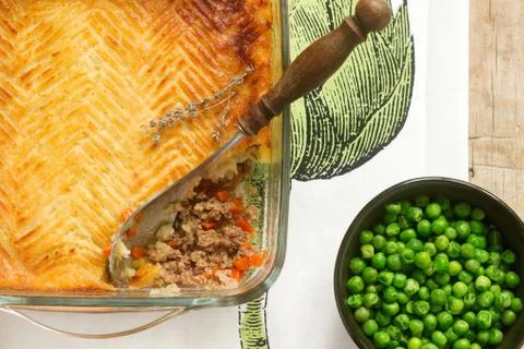 Shepherd's pie or cottage pie is a meat pie with a topping of mashed potato. Stock Photos