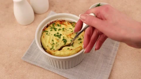 Shepherd's pie in a portioned white baking dish. Stock Footage 267718301