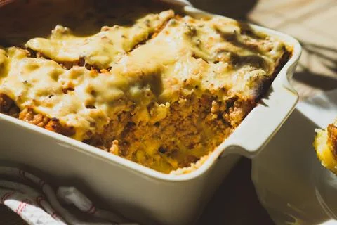 Shepherd's pie in white baking dish on the table Stock Photos