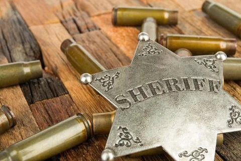 Sheriff badge and bullets shell Stock Photos