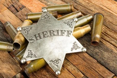 Sheriff badge and bullets shell Stockfoto's
