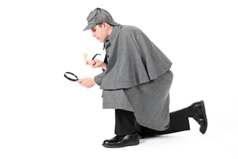 Sherlock: detective using magnifying glass to examine something Stock Photos