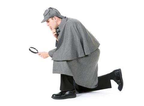 Sherlock: Detective Using Magnifying Glass To Examine Something Stock Photos
