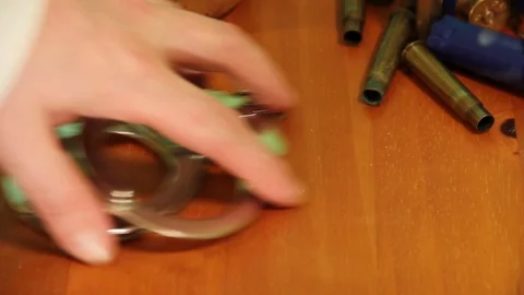 Sherriff picks up handcuffs Stock Footage 94003571