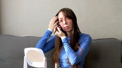 She's applying eye makeup as part of her personal at-home beauty routine Stock Footage 342838014