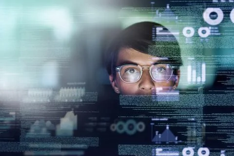 Shes a genius programmer. Cropped shot of a young computer programmer looking Stock Photos