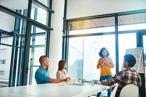 Shes got an answer for every question. colleagues working together in a modern Stock Photos