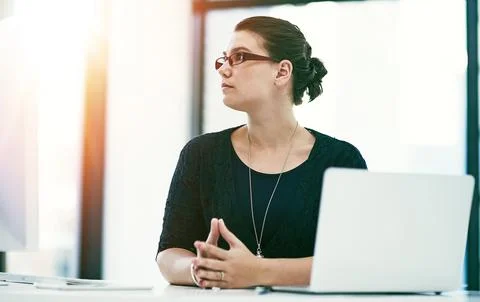 Shes got her sight fixed on success. a thoughtful young businesswoman working at Stock Photos
