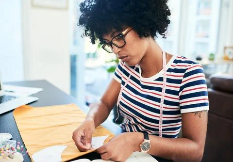 Shes using her sewing knowledge to make face masks. a young designer making face Stock Photos