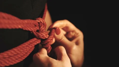 Shibari art with red ropes Stock Footage 101474632