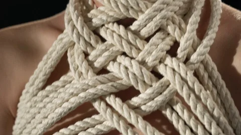 Shibari rope pattern around woman neck video Stock Footage 87039286