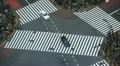 Shibuya Crossing Aerial View Tokyo Cars Passing Traffic Bus Urban Commuters Day HD Footage