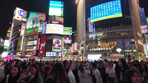 Shibuya intersection, crowded and traffic crossing the intersection Stock Footage 278167658