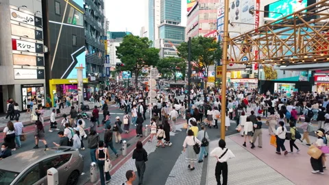 Shibuya intersection, crowded and traffic crossing the intersection Stock Footage 287070701