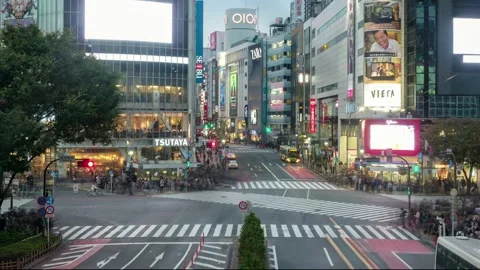 Shibuya intersection square with traffic and thoroughfare and crowded people  Stock Footage 201258408