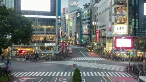 Shibuya intersection square with traffic and thoroughfare and crowded people  Stock Footage 201258574