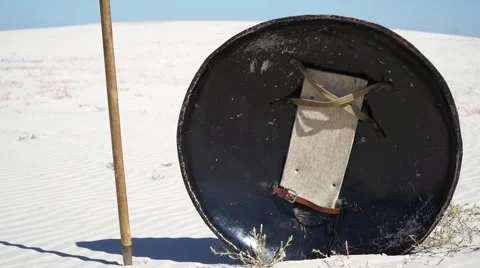 Shield and spear in the sand Stock Footage