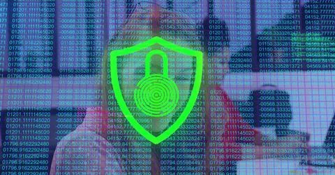 Shield appearing over office team causing pulsing red-green core moving digits Stock Photos
