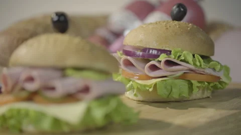 Shift of camera focus from one hamburger to another. 4k Video stock 143653268