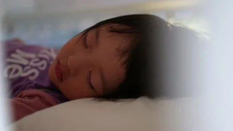 Shift focus Asian cute kid sleeping on her bed. Concept for goodnight and bed Stock Footage 146370496